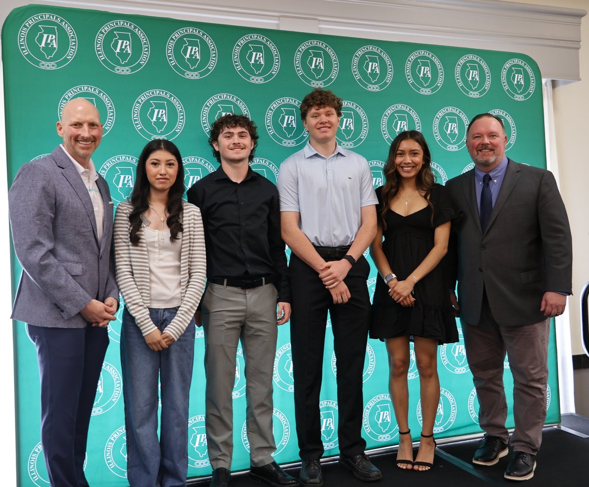 Students who won scholarships pose with Regional Superintendent Scott Bloomquist